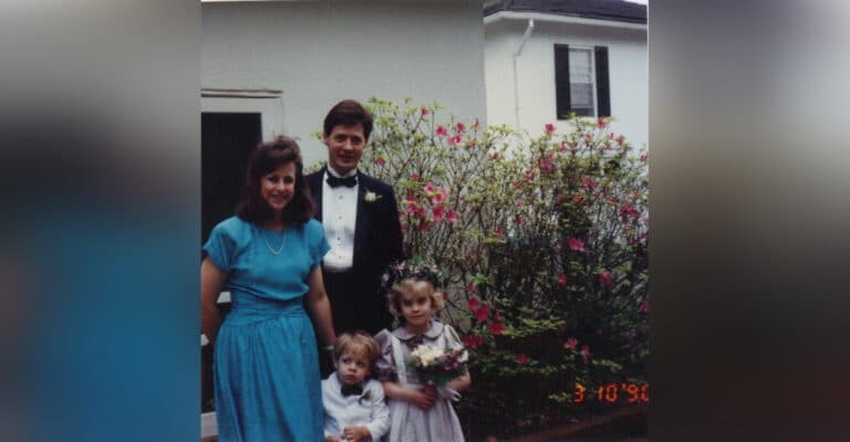 Older photo of mother, father, and two children, color photo