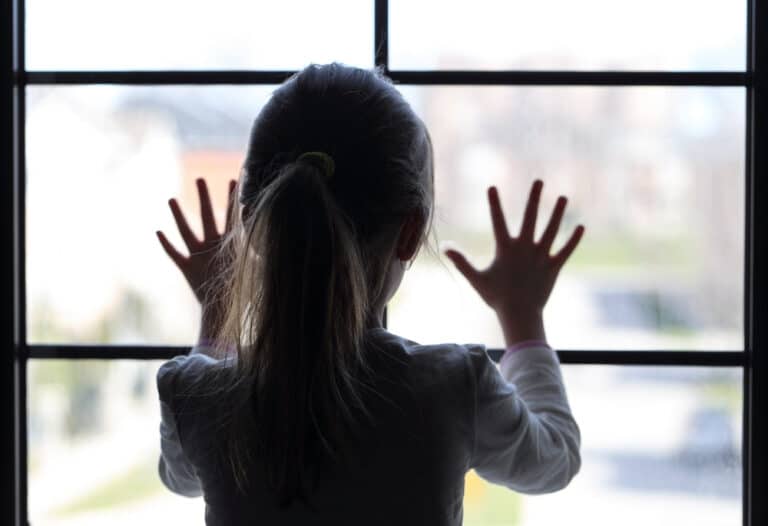 Young girl at window