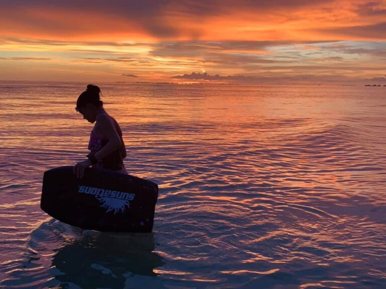 Teen girl standing in ocean water, color photo