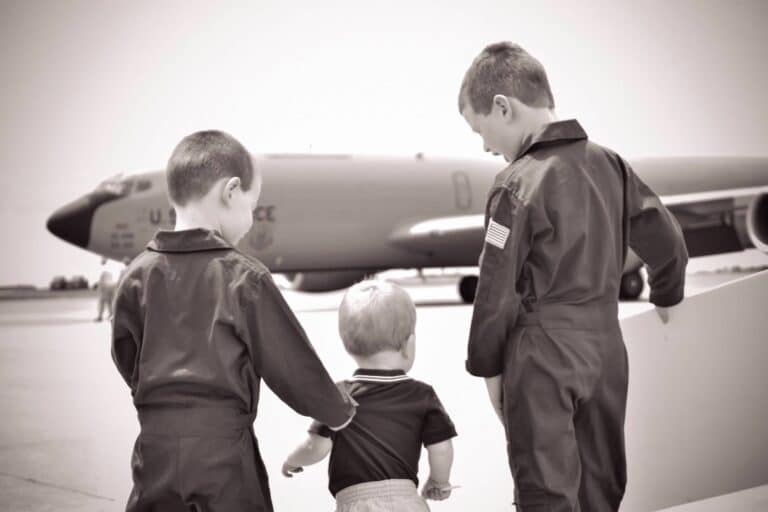Three children in patriotic clothing, black-and-white photo