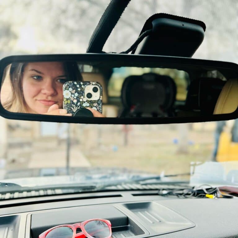 mom taking selfie in rearview mirror