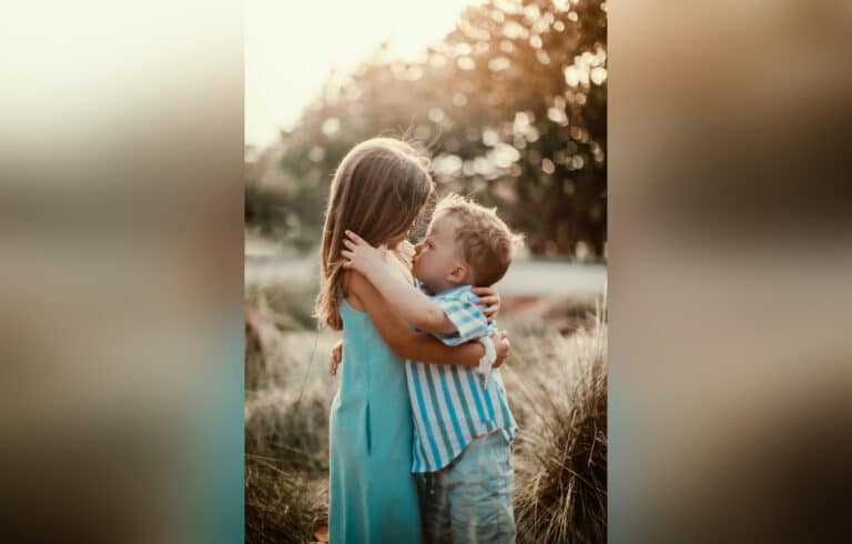 Brother and sister, hugging, color photo