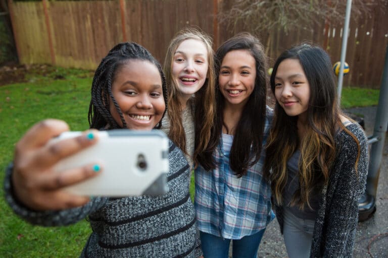 Middle school girls taking selfie