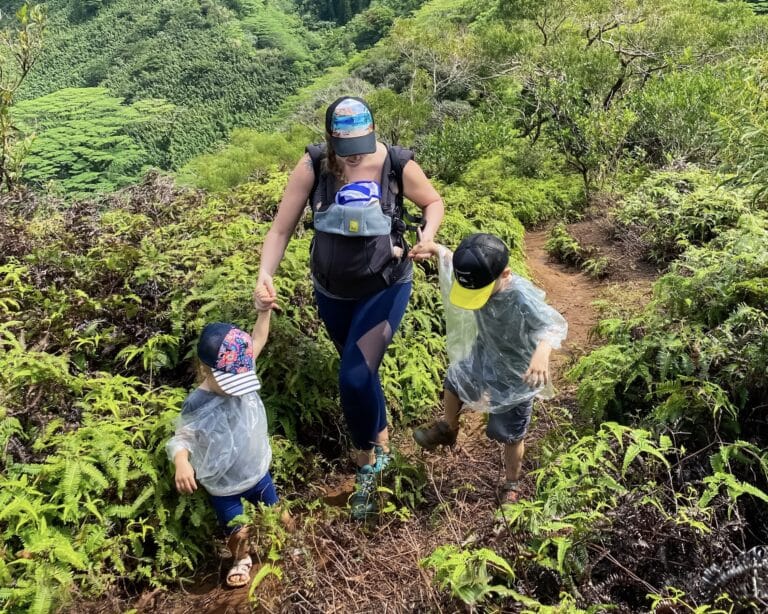 Mother on hiking path with two children, color photo