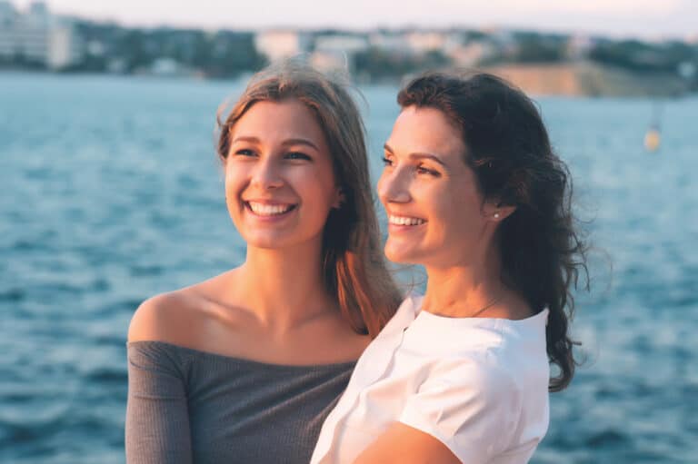 Mother and teen daughter smiling