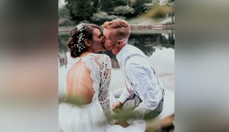 Bride and groom kissing, color photo