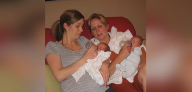 Mother and grown daughter with twin babies, color photo