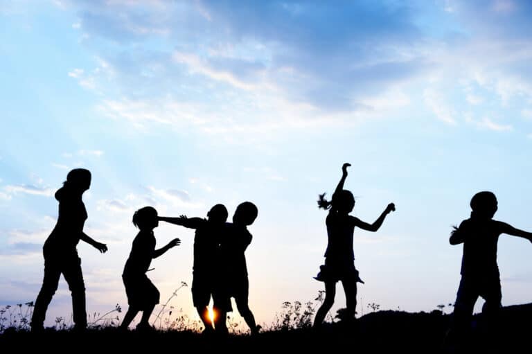 Kids playing silhouetted