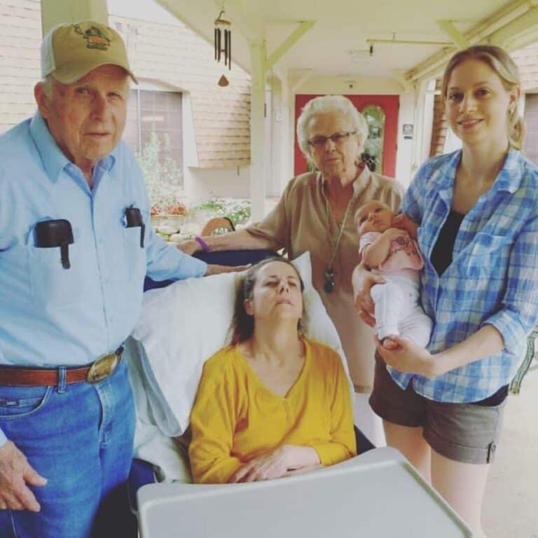 Family surrounding woman at end of her life