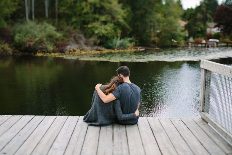 Couple on dock by lake