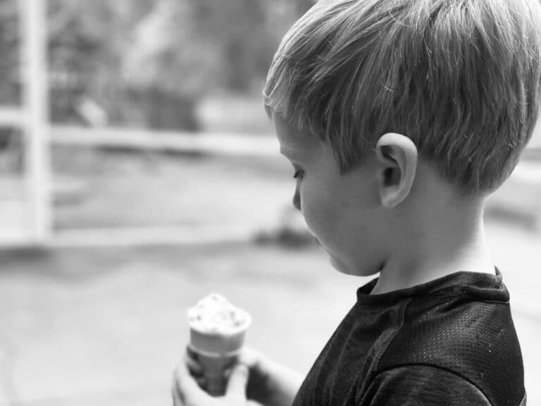 Little boy looking at ice cream cone