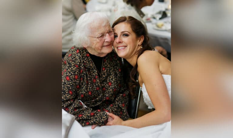 Elderly woman embracing young bride