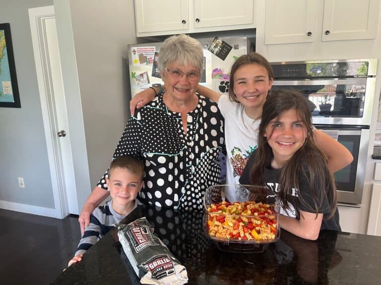 Grandma with grandkids and food