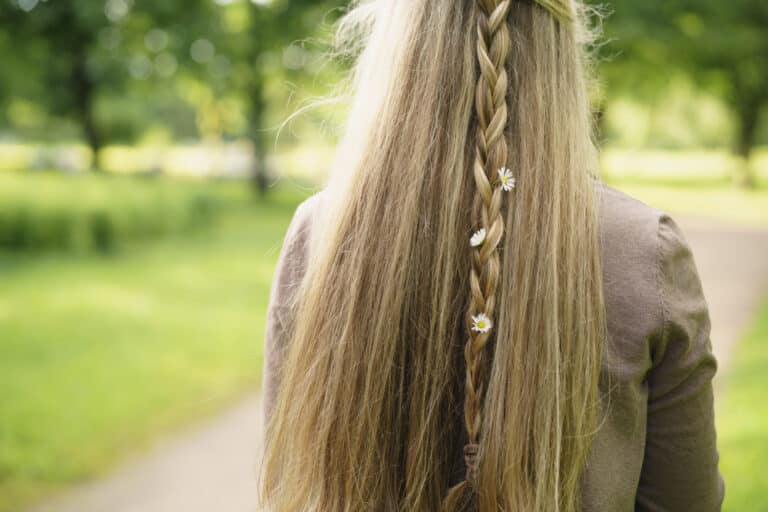 Teen girl walking away with long hair