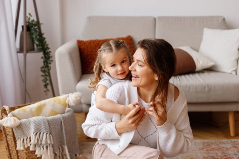Mother and daughter in living room