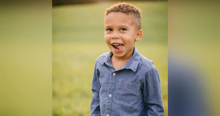 Little boy grinning, color photo
