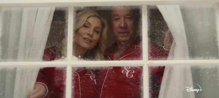Tim Allen Elizabeth Mitchell look out a holiday window in The Santa Clauses