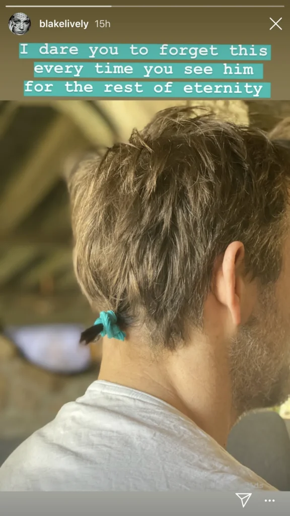 Picture of Ryan Reynold's hair in a mini ponytail