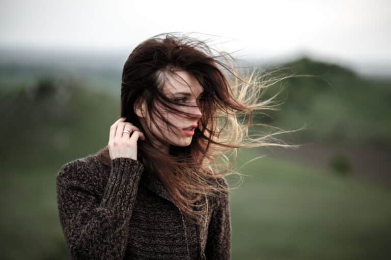 Woman with hair blowing in wind