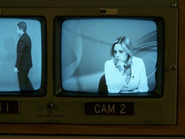 Black and white image of TV news camera shot in monitors
