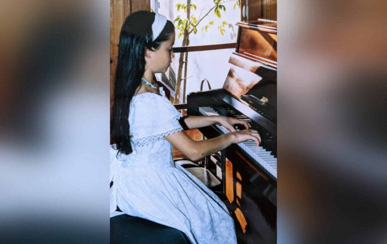 Little girl at piano, color photo