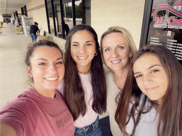 Mother and three teen daughters, color photo