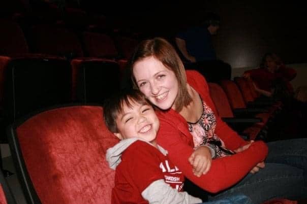 Mother and son in movie theater, color photo
