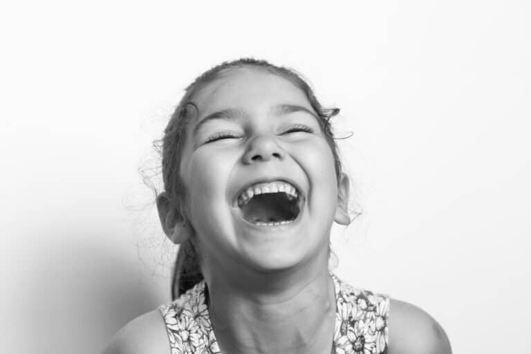 Laughing little girl, black and white photo