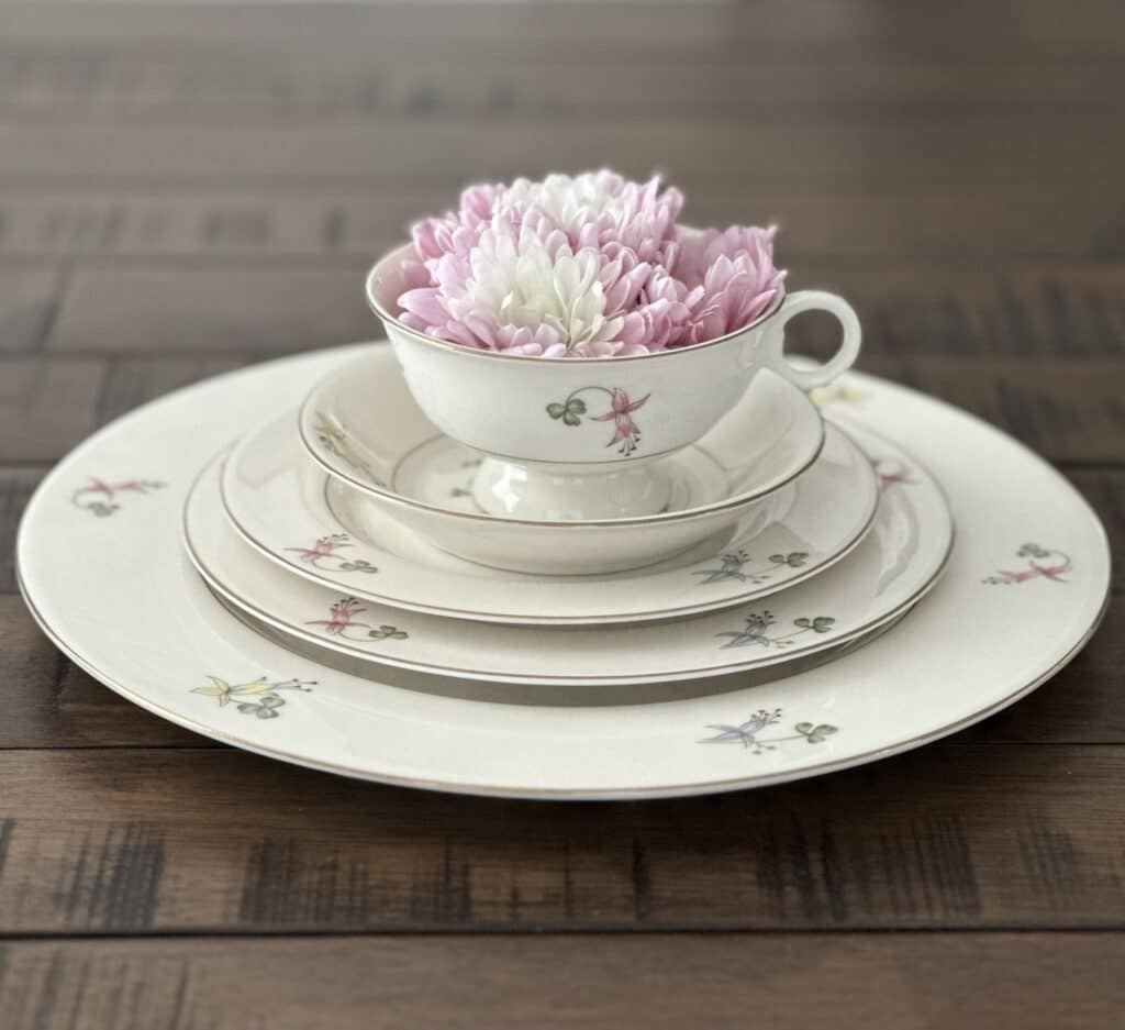 Wedding china with flower in saucer