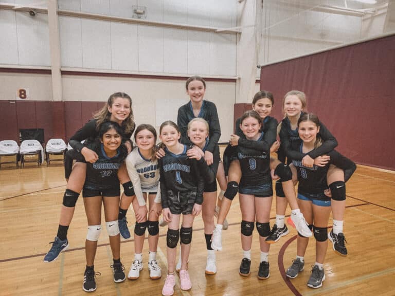 Youth volleyball team smiling