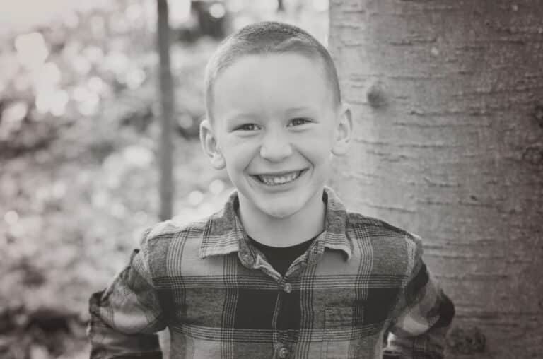 Little boy smiling, black-and-white photo