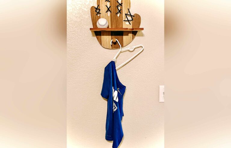 Shirt hanging from small hanger, color photo