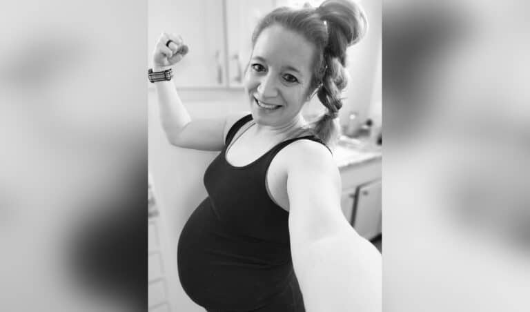 Black and white selfie of pregnant woman