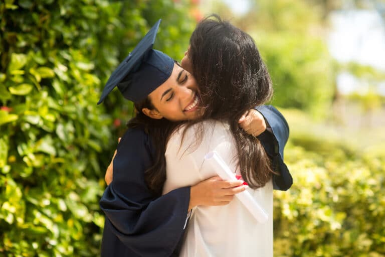 Mom hugging new grad