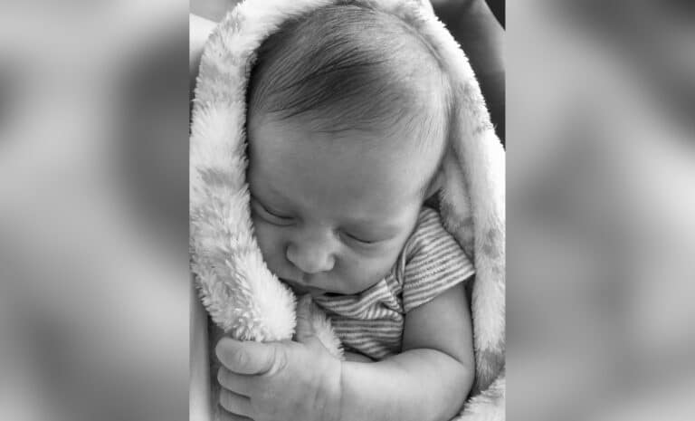 Black and white photo of a baby sleeping