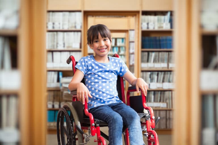 Child in a wheelchair smiling
