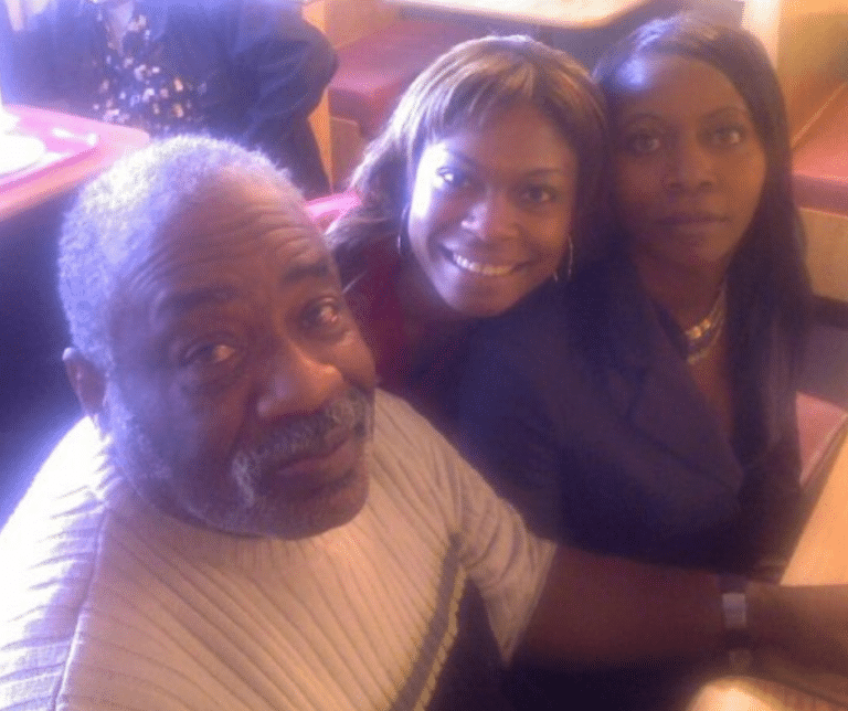 Two grown women with their father, color photo
