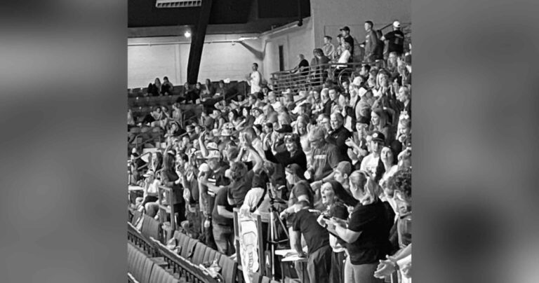 Crowd at sporting event, black-and-white photo