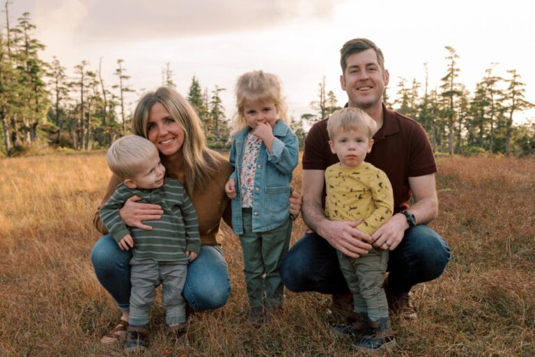 Family with preschool girl and twin boys, color photo
