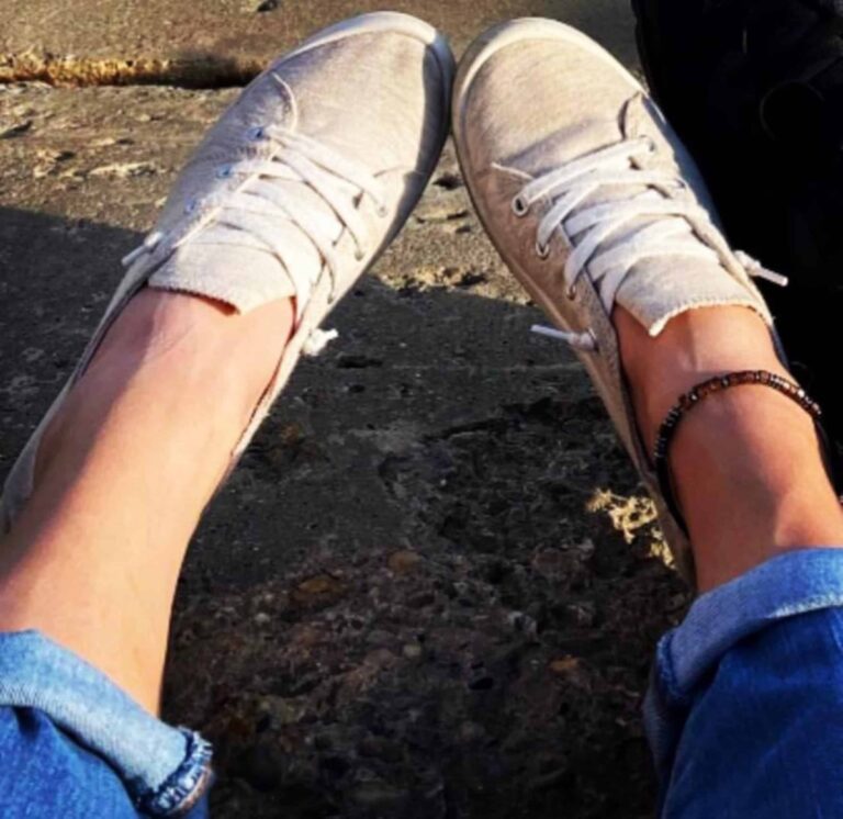 Picture of feet with rolled jeans, color photo
