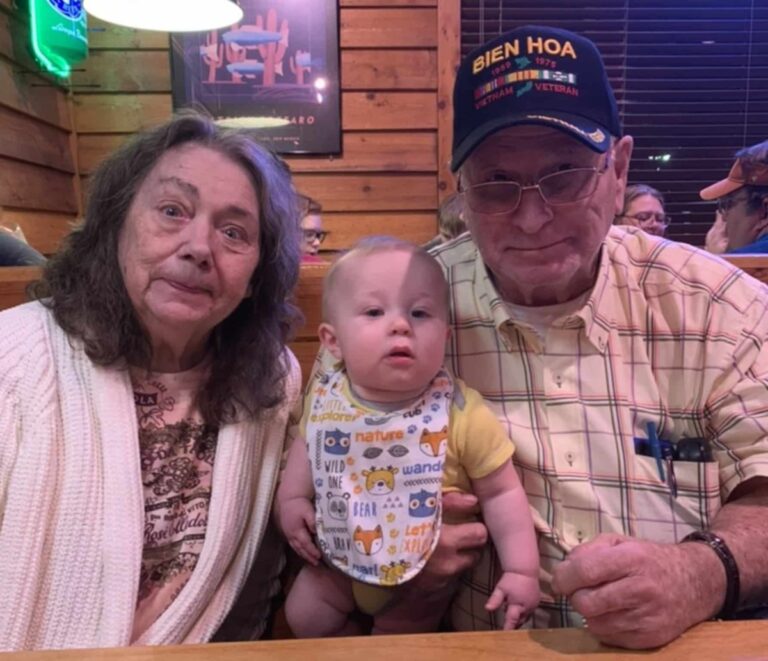 Grandma and grandpa with baby, color photo