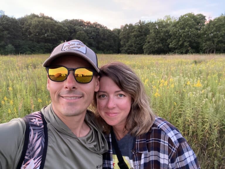 Husband and wife selfie in field of wildflowers, color photo