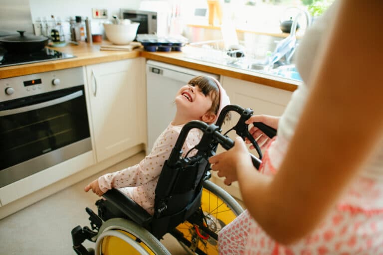 Girl in wheelchair smiling