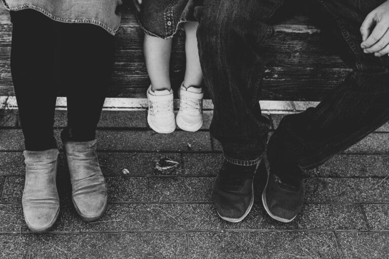 Family of three feet, black and white image