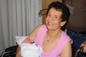 Grandmother holding newborn baby 