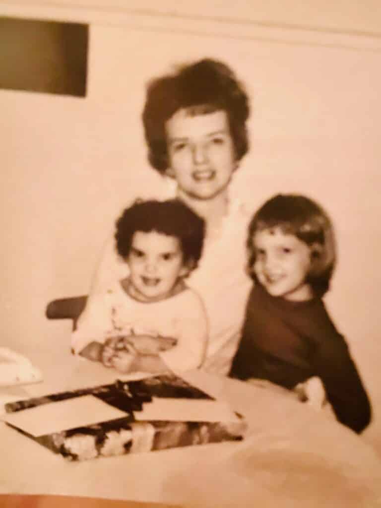 Picture of mother and two young daughters, old sepia photo