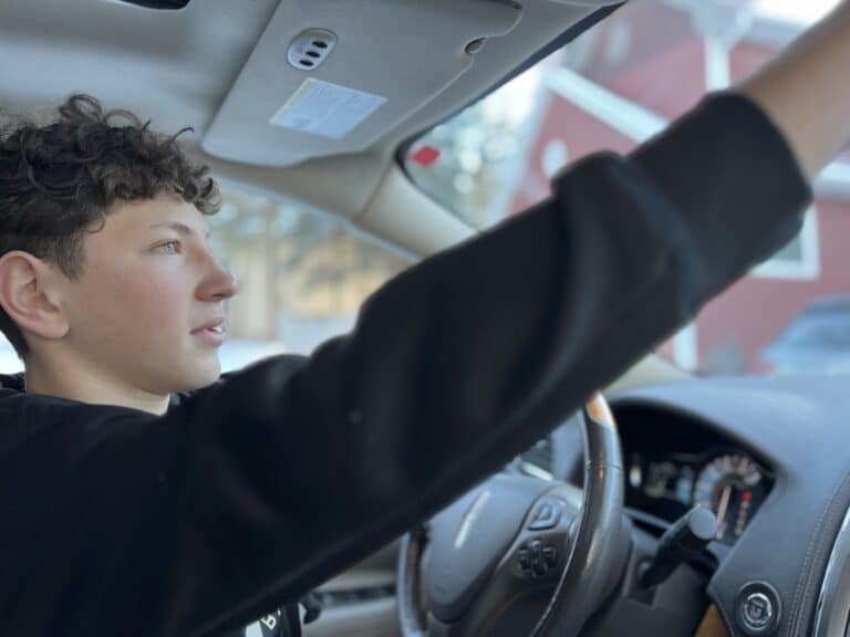 Teen boy behind the wheel, color photo