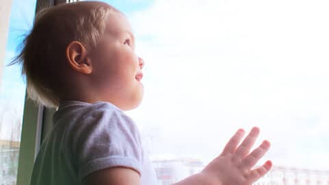 Child looking out window