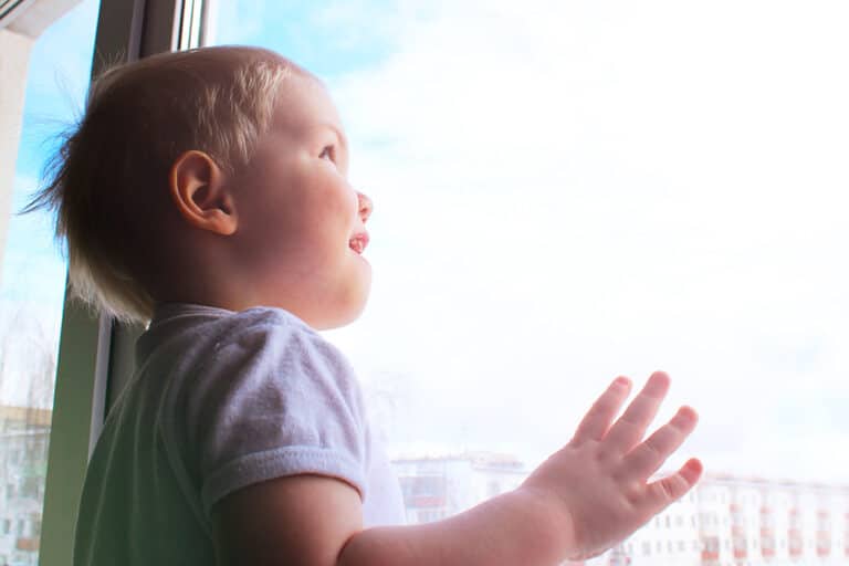 Child looking out window