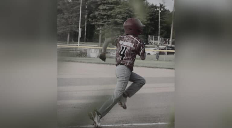 Young baseball player running
